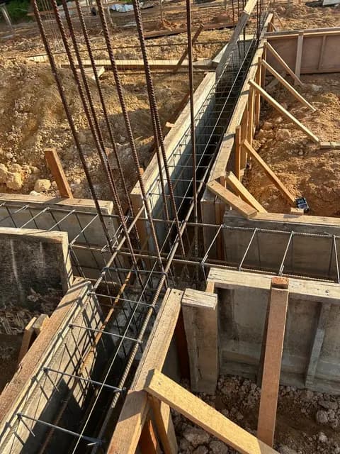 Concrete-beam formwork during site work.
