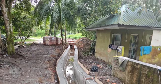 Drainage channel along the site boundary.