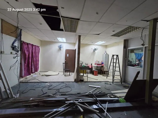 Work area before new cement-board partitions.