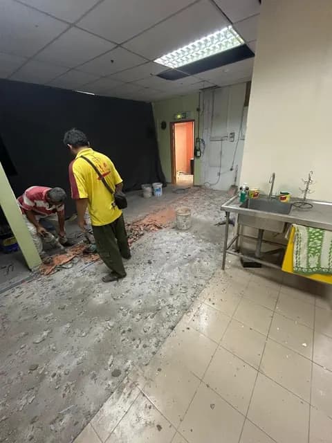 Floor tiling work in progress.