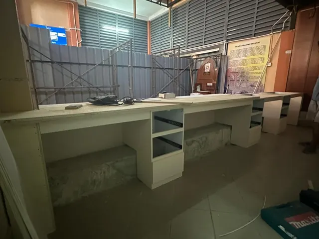 Pharmacy counter worktop and storage.