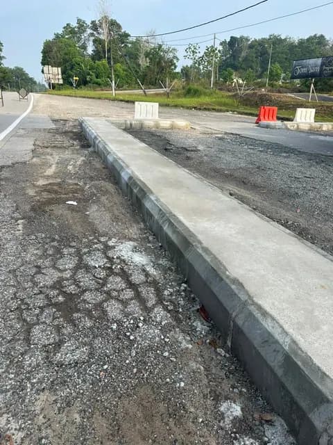 Road surface alongside the divider.
