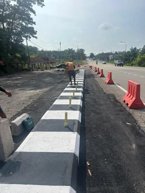 Work area alongside the road divider.