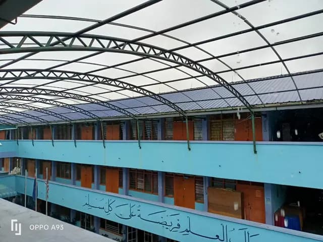 Roof framework spanning the courtyard at Sekolah Agama Bandar Segamat.